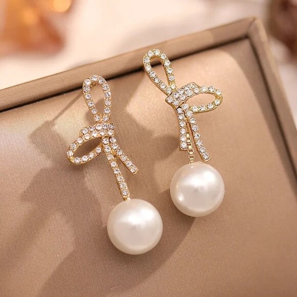 2/$24 Elegant Bow Pearl Drop Earrings With Rhinestone Accents Gold-Tone Finish - Picture 4 of 6